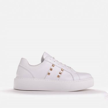 Light sneakers with gold studs