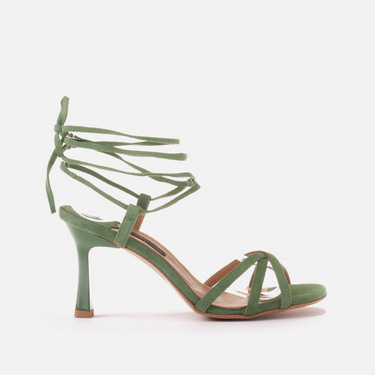 Elegant sandals on a high heel with a tied strap