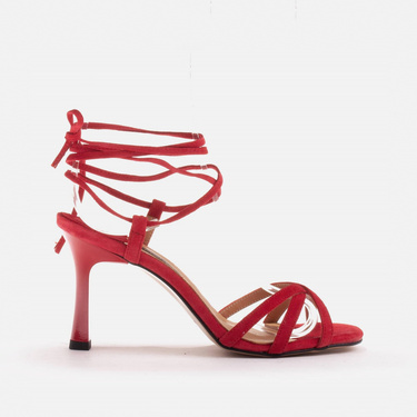 Elegant sandals on a high heel with a tied strap